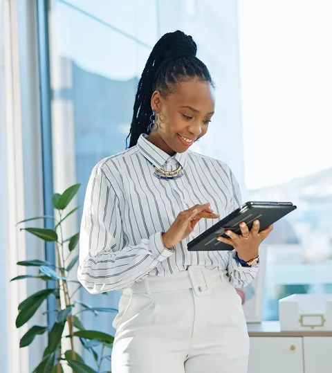 Professional woman using a tablet in an office